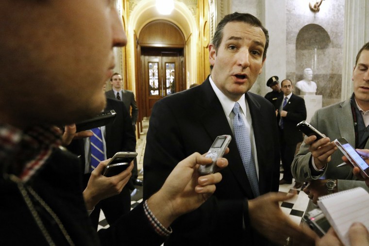 U.S. Senator Ted Cruz (R-TX) talks to reporters after the Senate passed a $1.1 trillion spending bill following a long series of votes at the U.S. Capitol in Washington on Dec. 13, 2014.