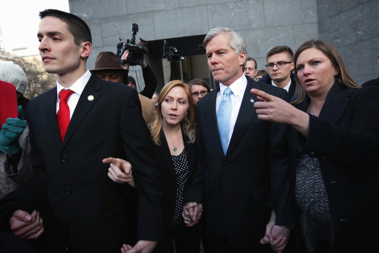 Former Virginia Governor Robert McDonnell (2nd R) comes out from U.S. District Court for the Eastern District of Virginia after his sentencing was announced by a federal judge on Jan. 6, 2015. (Photo by Alex Wong/Getty)