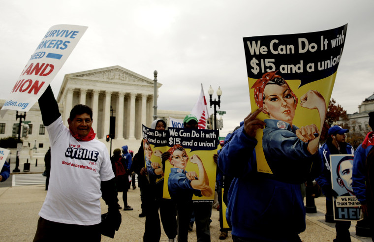 Low wage U.S. federal contract workers hold a strike rally, asking for a $15 per hour minimum wage, in front of the Capitol in Washington Nov. 13, 2014. (Photo by Gary Cameron/Reuters)