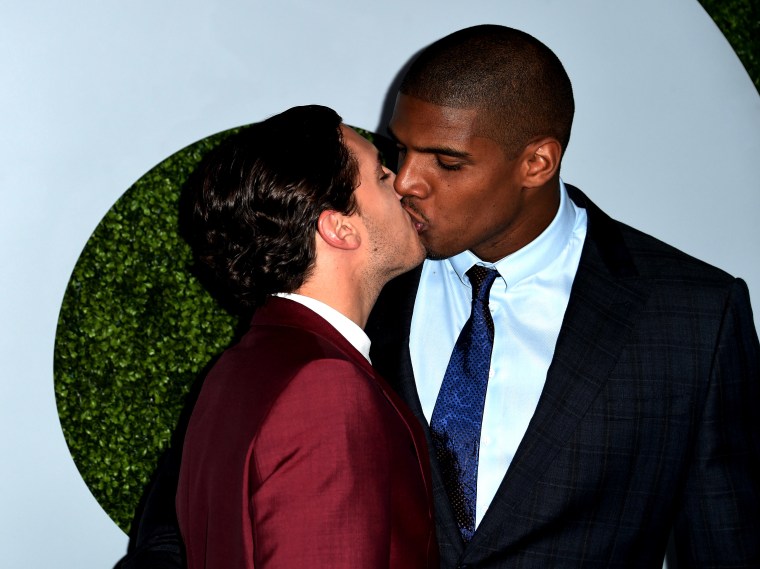 American football player Michael Sam (R) and Vito Cammisano kiss as they arrive for the GQ Men of the Year Party, at Chateau Marmont in West Hollywood, California, on Dec. 4, 2014. (Photo by Robyn Beck/AFP/Getty)