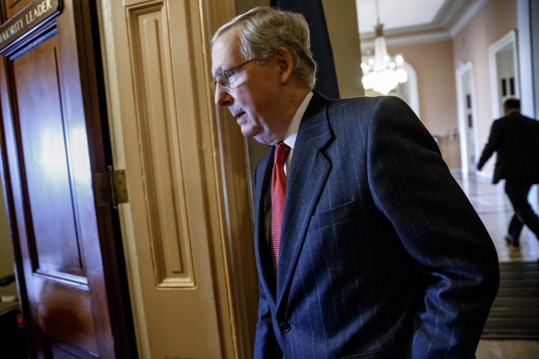 Senate Majority Leader Mitch McConnell walks to his office from the Senate chamber on Capitol Hill in Washington, on Jan. 8, 2015. (Photo by J. Scott Applewhite/AP)