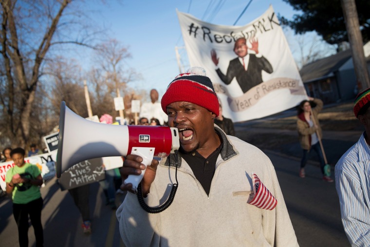 Demonstrators remember Michael Brown with a Martin Luther King Jr. Day march from the apartment complex where he was killed to the Ferguson police station on Jan. 19, 2015 in Ferguson, Mo. (Photo by Scott Olson/Getty)