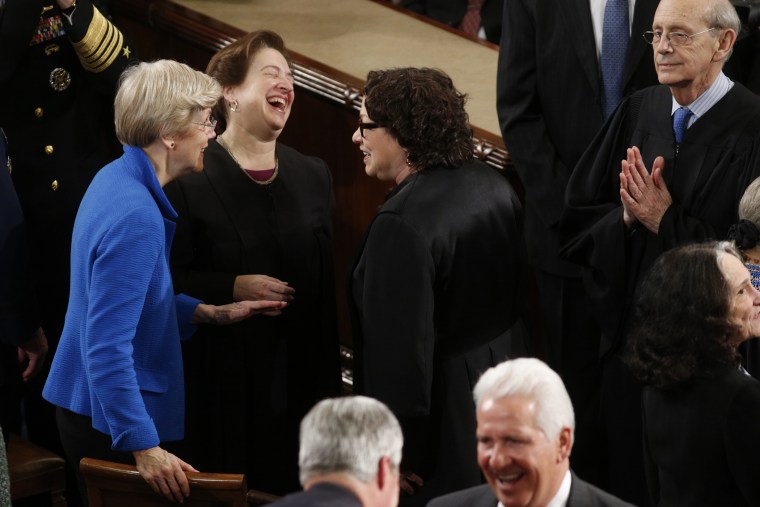 U.S. Senator Warren talks with U.S. Supreme Court Associate Justices Kagan and Sotomayor as Justice Breyer looks on before U.S. President Obama's State of the Union address to a joint session of Congress in the U.S. Capitol in Washington