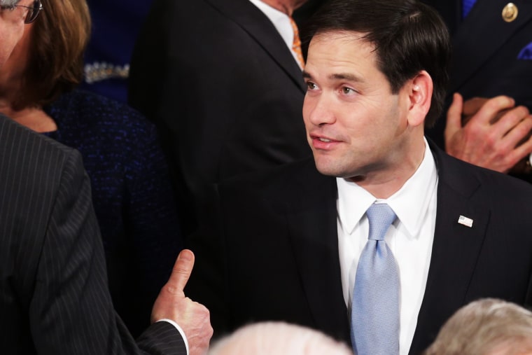 U.S. Sen. Marco Rubio (R-FL) (C) shakes hands before the start of the State of the Union speech in the House chamber of the U.S. Capitol on Jan. 20, 2015 in Washington, DC. (Photo by Alex Wong/Getty)