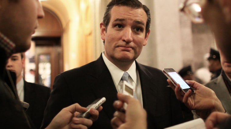 Sen. Ted Cruz (R-TX) talks with reporters after the Senate voted on a $1.1 trillion spending bill to fund the government through the next fiscal year on on Dec. 13, 2014 on Capitol Hill in Washington, D.C. (Photo by Lauren Victoria Burke/AP)