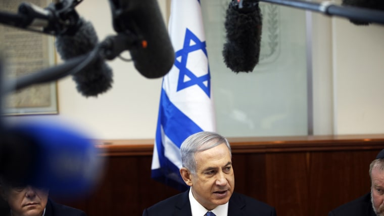Israel's Prime Minister Benjamin Netanyahu, center, chairs the weekly cabinet meeting in Jerusalem, Nov. 30, 2014. (Photo by Ronen Zvulun/Pool/AP)