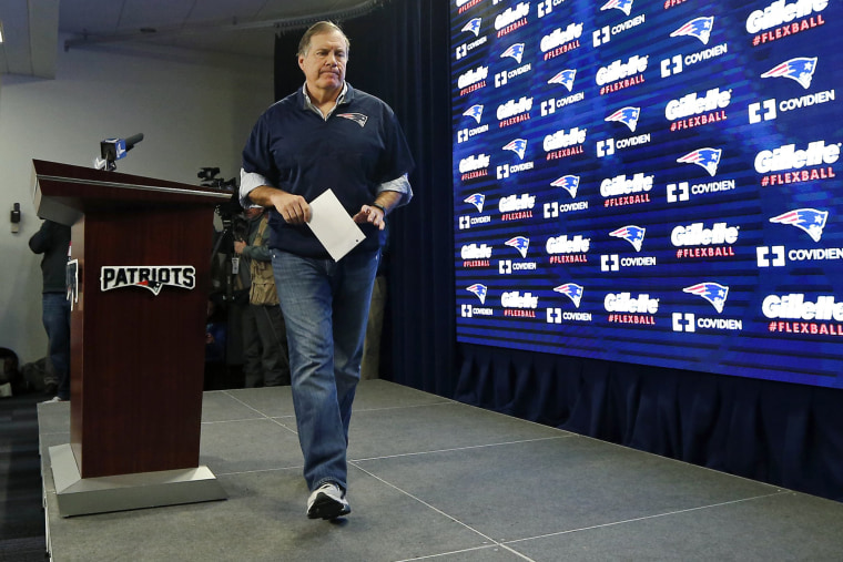 New England Patriots head coach Bill Belichick walks from the podium after a news conference prior to a team practice in Foxborough, Mass., on Jan. 22, 2015. (Photo by Elise Amendola/AP)