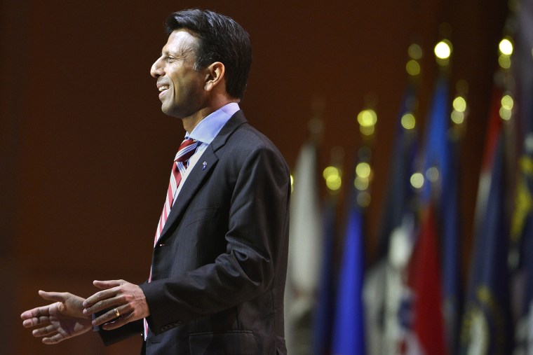 Louisiana Gov. Bobby Jindal greets guests as he arrives to address the Conservative Political Action Conference (CPAC) in Oxon Hill, Md., March 6, 2014. (Photo by Mike Theiler/Reuters)