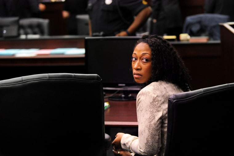 Marissa Alexander looks back to the gallery while the lawyers involved in the case have a sidebar discussion with Judge James Daniel Wednesday, April 2, 2014. (Photo by Bob Mack/The Florida Times-Union/AP)