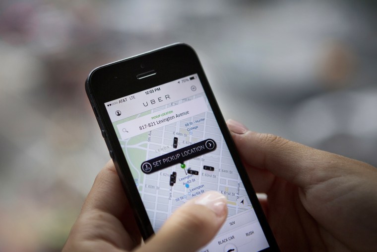 Th Uber Technologies Inc. car service application (app) is demonstrated for a photograph in New York on Aug. 6, 2014. (Photo by Victor J. Blue/Bloomberg/Getty)