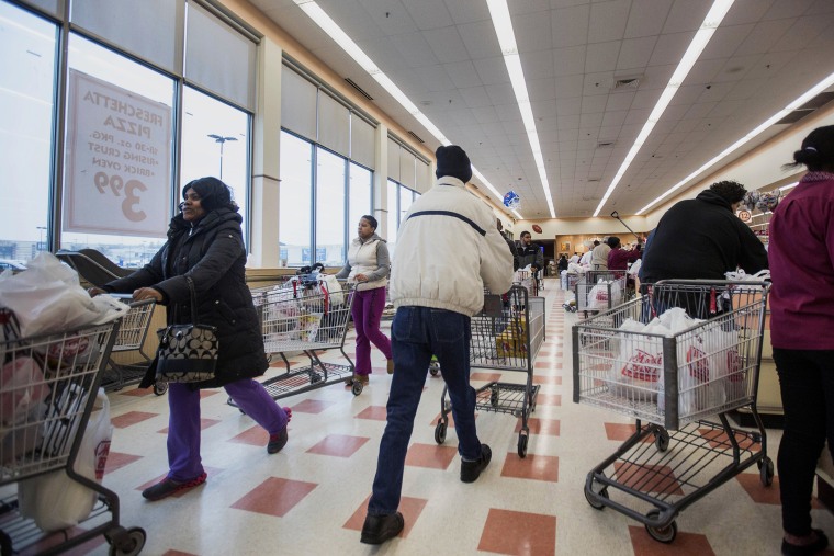 Customers push carts while stocking up for the storm at Market Basket in Brockton, Mass., on Jan. 26, 2015. (Photo by Scott Eisen/Bloomberg/Getty)