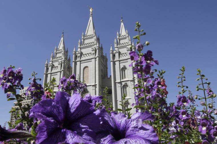 In this Sept. 3, 2014, file photo, shows flowers blooming in front of the Salt Lake Temple. in Temple Square, in Salt Lake City. (Photo by Rick Bowmer/AP)