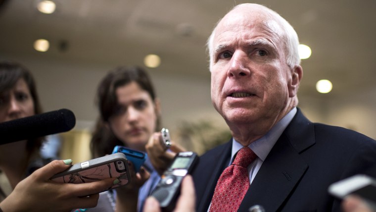 Sen. John McCain, R-Ariz.,speaks with reporters in the Capitol on June 10, 2014, in Washington, D.C. (Photo By Bill Clark/CQ Roll Call/Getty)