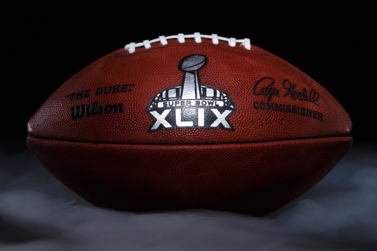 An official game ball for the NFL football Super Bowl XLIX is photographed, Jan. 20, 2015, at the Wilson Sporting Goods football factory in Ada, Ohio. (Photo by Rick Osentoski/AP)