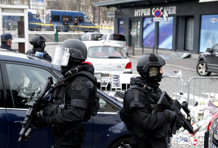 French RAID forces secure the area of the Hyper Cacher kosher supermarket, where four hostages were killed in a terror attack on Jan. 9, for a visit by Israel's Prime Minister Benjamin Netanyahu on Jan. 12, 2015. (Photo by Charles Platiau/Reuters)