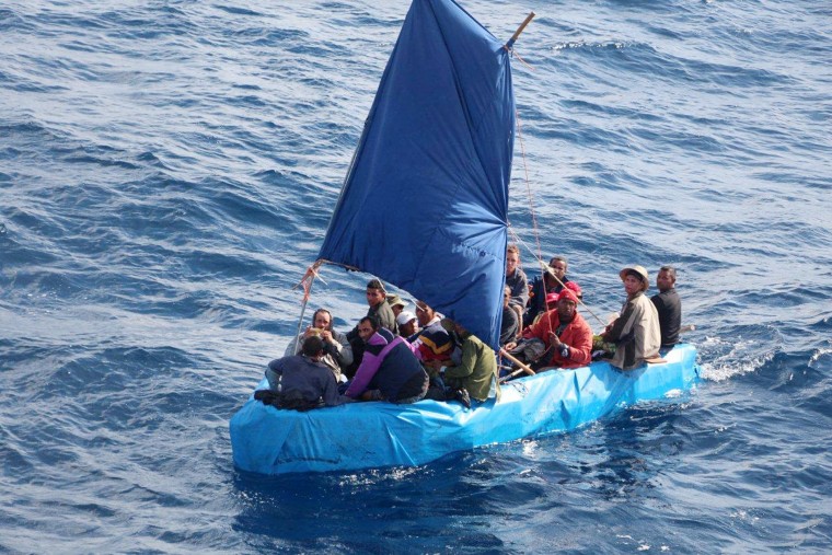 This Jan. 1, 2015 photo provided by the U.S. Coast Guard shows 24 Cuban migrants in the waters south of Key West, Fla