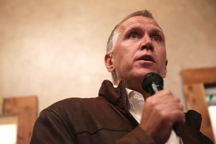 Then, Republican U.S. Senate candidate Thom Tillis speaks to voters during a Davie County GOP rally Nov. 2, 2014 in Mocksville, N.C. (Photo by Alex Wong/Getty)