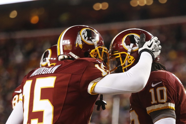 Players on the Washington Redskins celebrate after scoring a touchdown during the second half of a NFL football game in Landover, Md., on Dec. 30, 2012. (Photo by Jonathan Ernst/Reuters)
