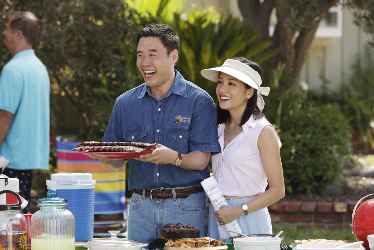 Randall Park, left, and Constance Wu appear in a scene from the new comedy series \"Fresh Off the Boat\" on ABC. (Nicole Wilder/ABC/AP)