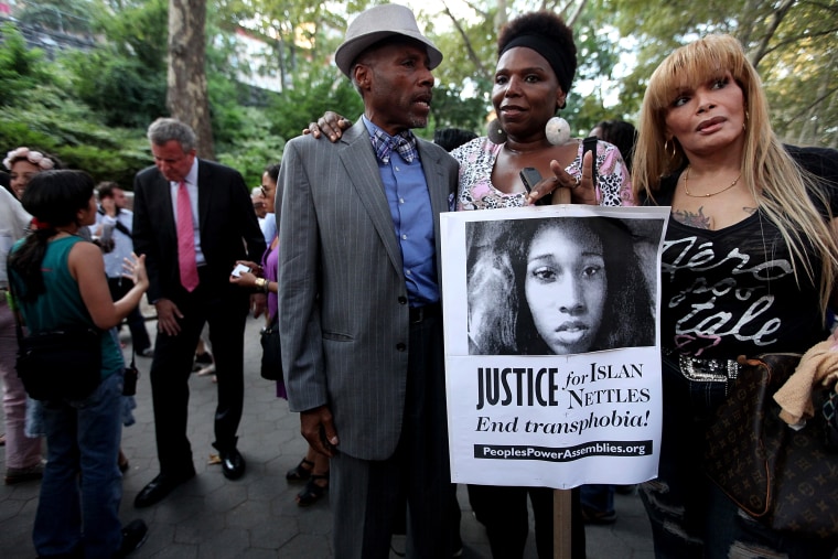 People gather along with Bill de Blasio (back, L) before a vigil for slain transgender woman Islan Nettles at Jackie Robinson Park in Harlem on Aug. 27, 2013 in New York City. (Photo by Mario Tama/Getty)