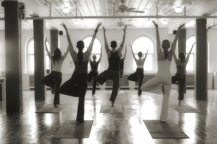 A yoga class. (Photo by Sally Gall/Gallery Stock)
