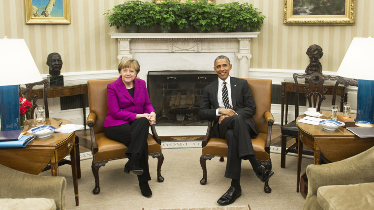US President Barack Obama and German Chancellor Angela Merkel hold a meeting in the Oval Office of the White House in Washington, D.C., Feb. 9, 2015. (Photo by Saul Loeb/AFP/Getty)