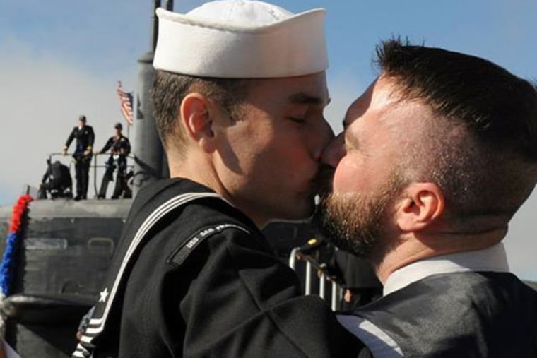 Petty Officer 2nd Class Thomas Sawicki greets his boyfriend following his return in San Diego, Calif.