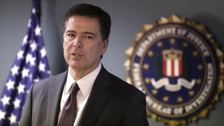 FBI Director James Comey takes questions from members of the media during a news conference, Nov. 18, 2014, in Boston. (Photo by Steven Senne/AP)