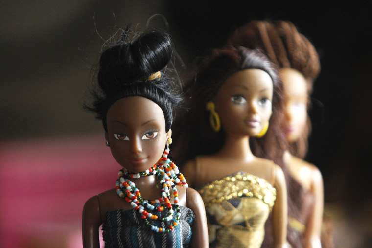A bead necklace is seen on a doll dressed in local attire, in a workshop in Surulere district, in Nigeria's commercial capital Lagos on Jan. 8, 2014. (Photo by Akintunde Akinleye/Reuters)