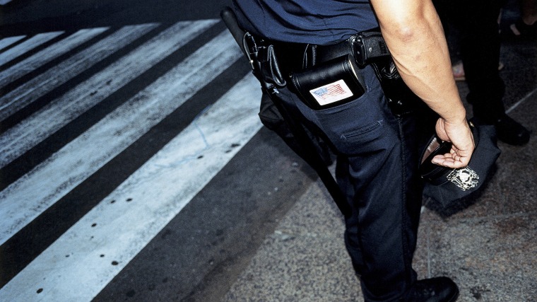 A police officer on a street. (Photo by Alessandro Rizzi/Gallery Stock)