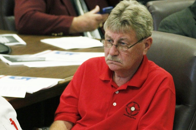 Gene Alday, R-Walls, listens to a collegue during a hearing  in Jackson, Miss., Oct. 2, 2012. (Photo by Rogelio V. Solis/AP)