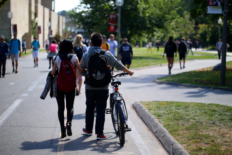 Students on the campus of UMass Amherst. (Photo by Jonathan Wiggs/Boston Globe/Getty)