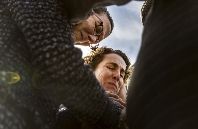 Suzanne Bryant, left, and Sarah Goodfriend pray over their marriage vows with Rabbi Kerry Baker outside of the Travis County Clerk's office in Austin, Texas on Feb. 19, 2015. (Photo by Austin American-Statesman, Ricardo B. Brazziell/AP)