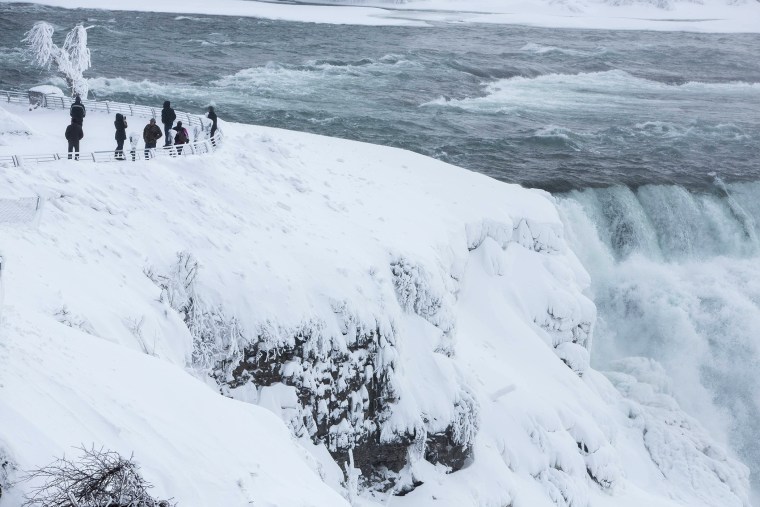 Visitors view Niagara Falls in sub freezing temperatures in Niagara Falls, N.Y. on Feb. 17, 2015.