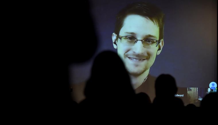 Edward Snowden greets the audience before he is honoured with the Carl von Ossietzky medal by International League for Human Rights to during a video conference call after he received the award in Berlin Dec. 14, 2014. (Photo by Tobias Schwarz/AFP/Getty)
