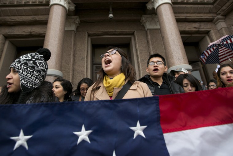 Maria Yolisma Garcia, 20, of Dallas, center, rallies in support of the HB1403, the Texas DREAM Act, at a demonstration at the Capitol in Austin, Texas, on Jan. 14, 2015. (Photo by Jay Janner/Austin American-Statesman/AP)