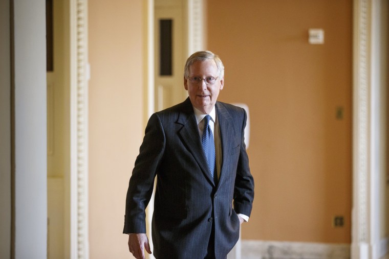 Senate Majority Leader Mitch McConnell of Ky. leaves a weekly Republican policy luncheon on Capitol Hill in Washington on Jan. 13, 2015. (Photo by J. Scott Applewhite/AP)