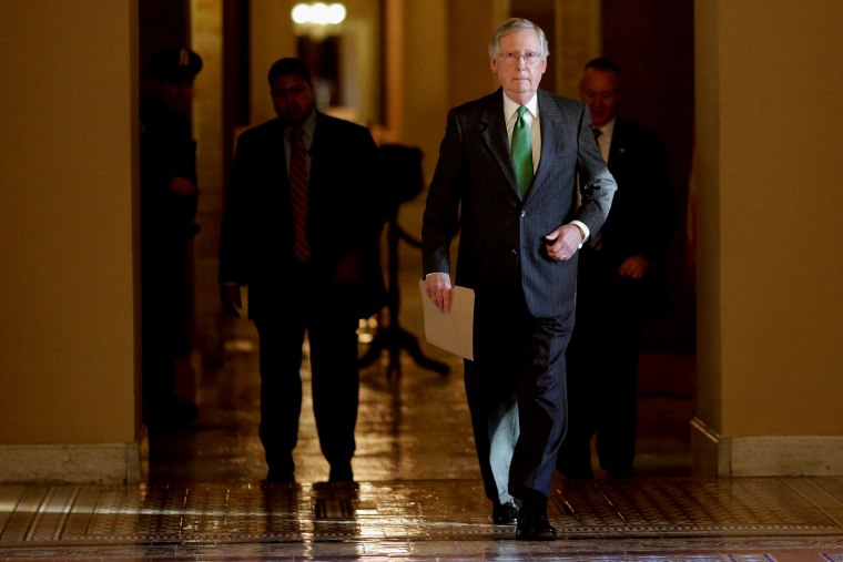 Senate Majority Leader Mitch McConnell (R-KY) walks from his office in the U.S. Capitol to the Senate chamber to open debate on a funding bill for the Department of Homeland Security on Feb. 23, 2015 in Washington, DC.