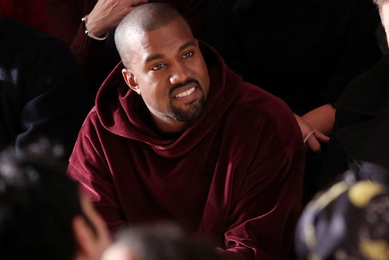 Kanye West watches the Jeremy Scott fall 2015 fashion show at Milk Studios on Feb. 18, 2015 in New York City. (Photo by Taylor Hill/FilmMagic/Getty)