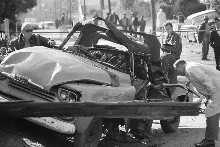 Natchez police and agents from the FBI inspect a truck in Natchez, Miss., Feb. 28, 1967, which exploded from a bomb blast and killed Wharlest Jackson, ex-treasurer of the local NAACP. (Photo by AP)