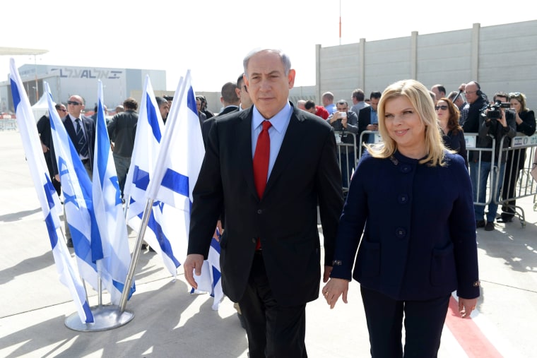 An Israeli government press office handout of Israeli Prime Minister Benjamin Netanyahu with his wife Sarah leaving Tel Aviv, Israel, on March 1, 2015 on their way to Washington D.C. (Photo by Amos Ben Gershom/GPO/EPA)