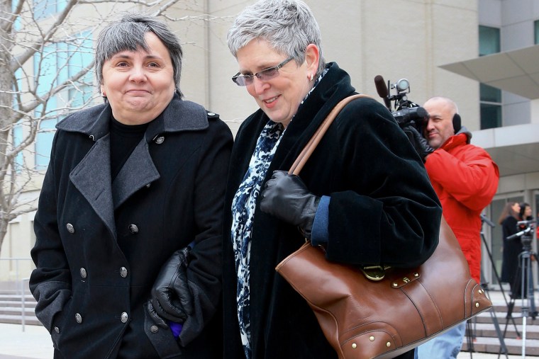 Susan Waters, left, and Sally Waters walk away from Federal Court in Omaha, Neb., after a hearing, Feb. 19, 2015. (Photo by Nati Harnik/AP)