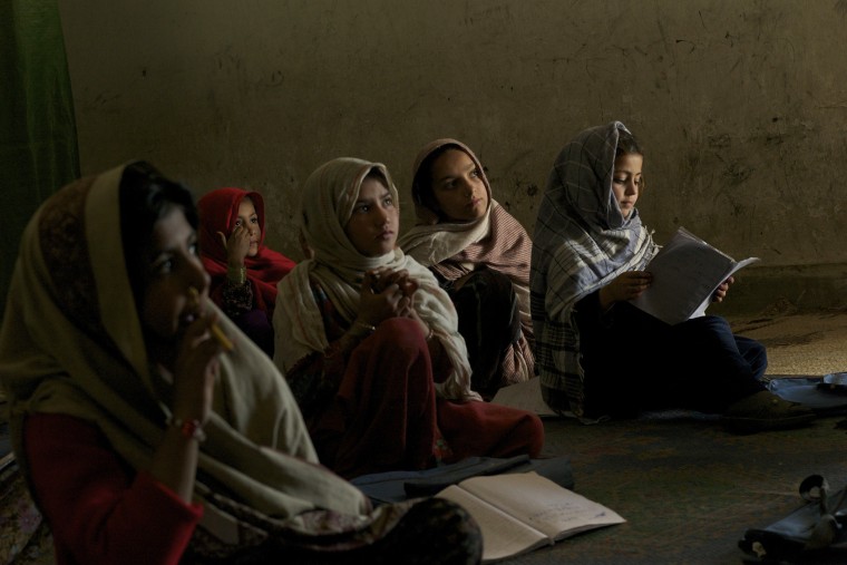 A group of conflict displaced Bajauri girls sit in a class in a UNICEF supported school in Risalpur, Pakistan in 2011.