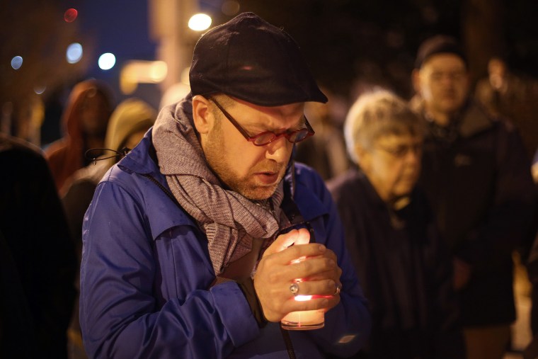 Michael Patter, senior minister at Central Congregational United Church of Christ, prays silently during a vigil for Kelly Gissendaner and protest against the death penalty on March 2, 2015, on the steps of the State Capitol.