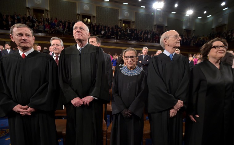 US Supreme Court Justices (L-R) John G. Roberts, Anthony M. Kennedy, Ruth Bader Ginsburg, Stephen G. Breyer and Sonia Sotomayor stand before the State of the Union address on Jan. 20, 2015 in Washington, DC. (Photo by Mandel Ngan-Pool/Getty)