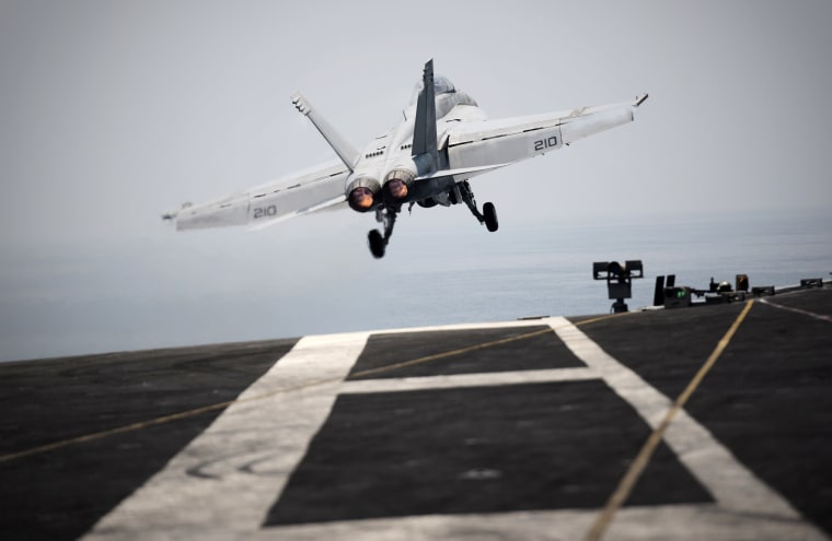 An F/A-18C hornet takes off for Iraq from the flight deck of the US navy aircraft carrier USS George H.W. Bush on Aug. 15, 2014 in the Gulf. (Photo by Mohammed Al-Shaikh/AFP/Getty)