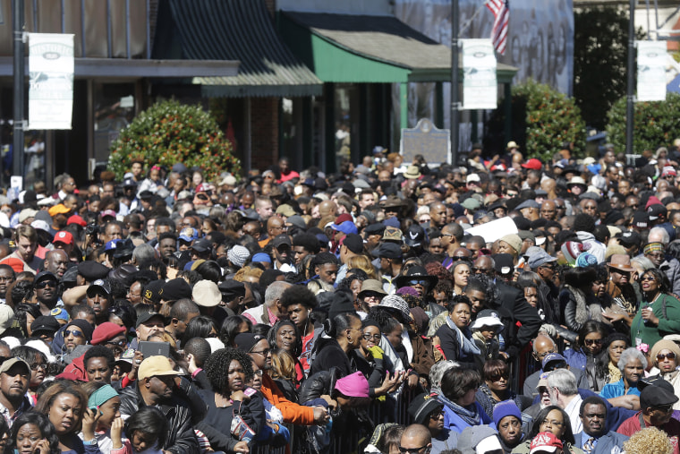 A large crowd forms near a stage where President Barack Obama will speak and then take a symbolic walk across the Edmund Pettus Bridge on March 7, 2015, in Selma, Ala. (Photo by Gerald Herbert/AP)