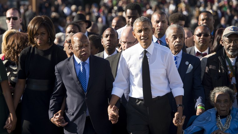 US President Barack Obama walks across the Edmund Pettus Bridge to mark the 50th Anniversary of the Selma to Montgomery civil rights marches in Selma, Ala. on March 7, 2015. (Photo by Saul Loeb/AFP/Getty)