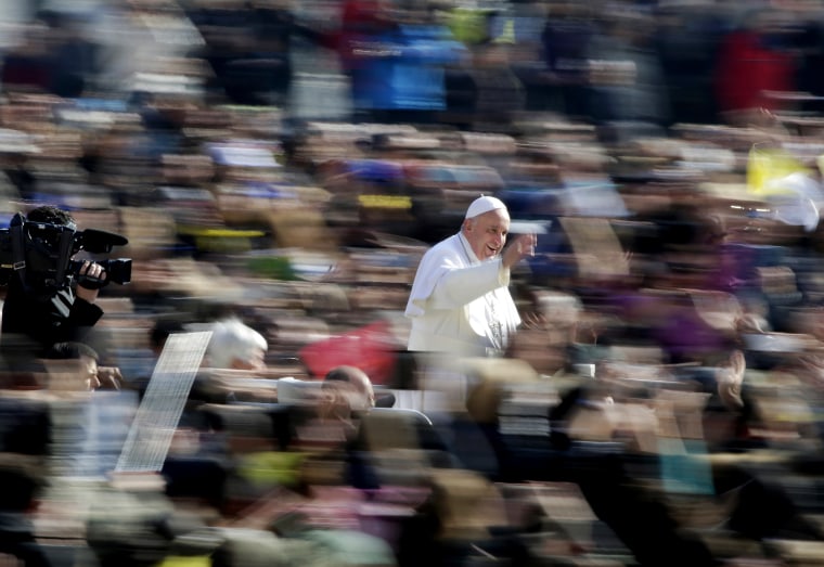 Pope Francis waves as he arrives during the general audience in St. Peter's Square at the Vatican March 4, 2015. (Photo by Max Rossi/Reuters)