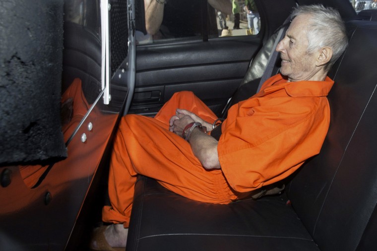 Robert Durst sits in a police vehicle as he leaves a courthouse in New Orleans, Louisiana on March 17, 2015.